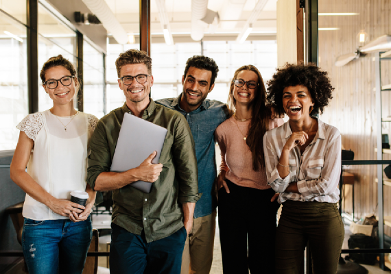 young people smiling in an office